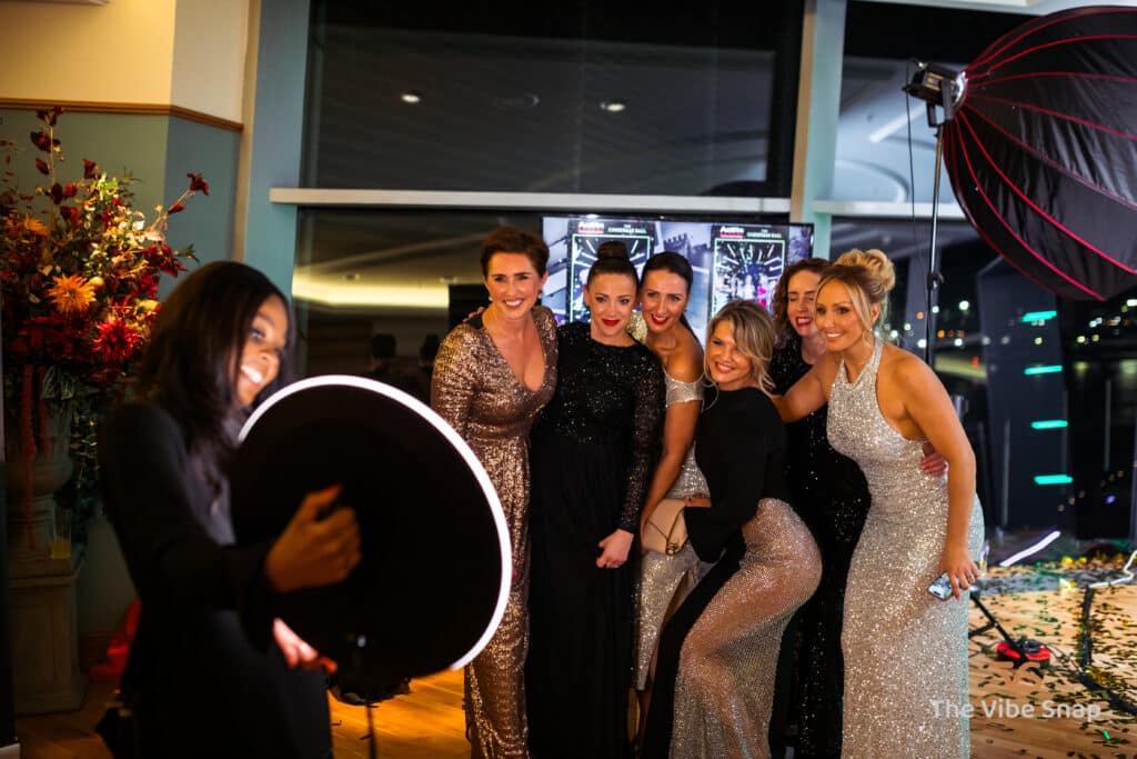 Ladies at a party, enjoying having their photos taken on the Roamer Booth.
