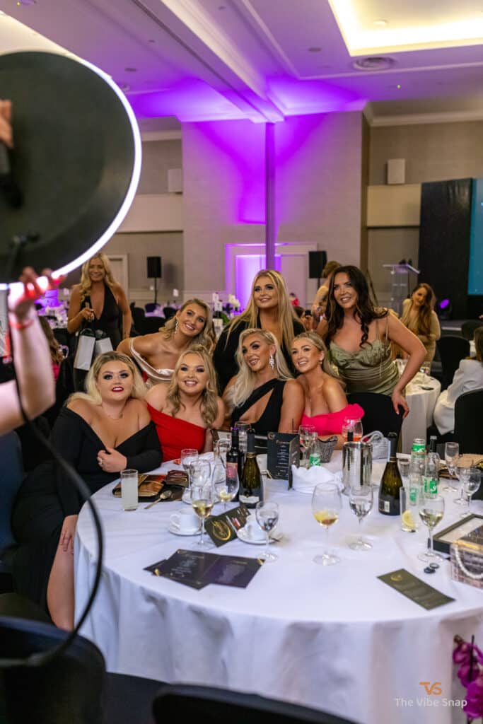 A group of lovely ladies having fun posing to have their photos taken on the roamer booth
