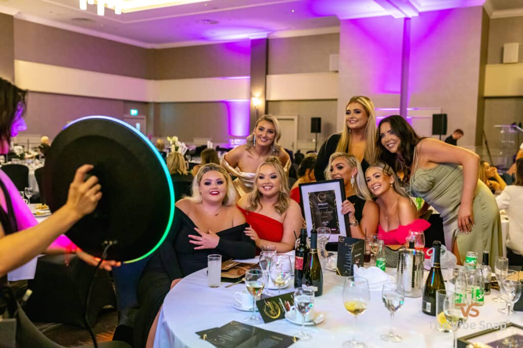A group of lovely ladies having fun posing to have their photos taken on the roamer booth
