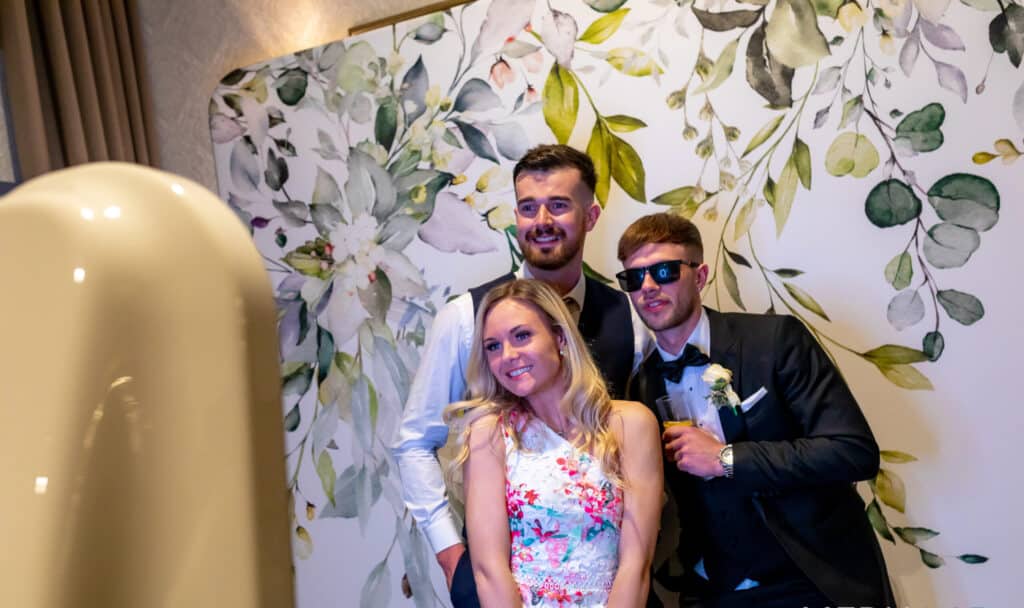 Male and female guests using the Salsa booth