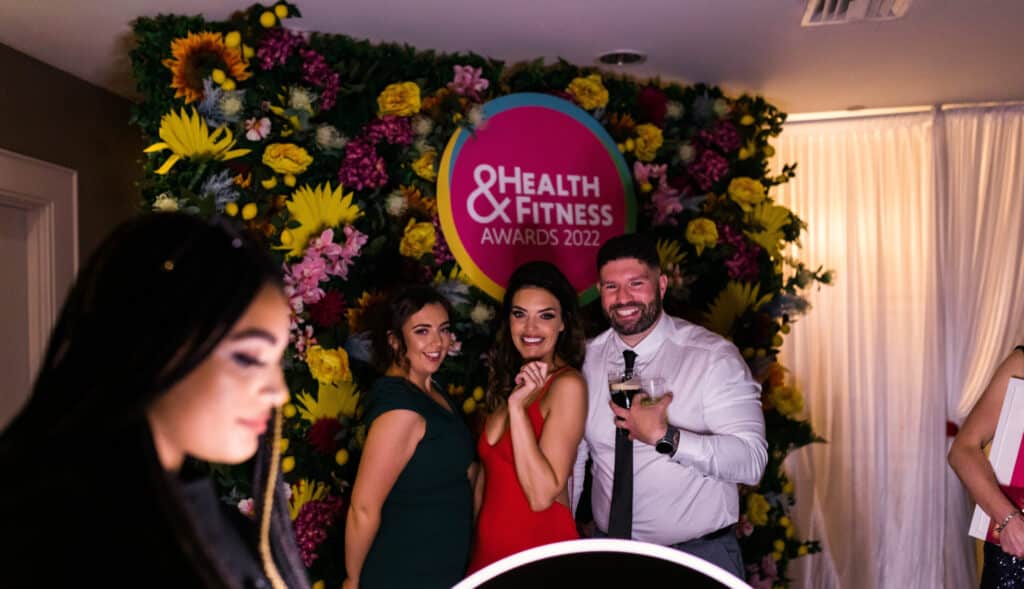 Guests having fun getting ready to have photos taken on the Roamer Ipad Booth