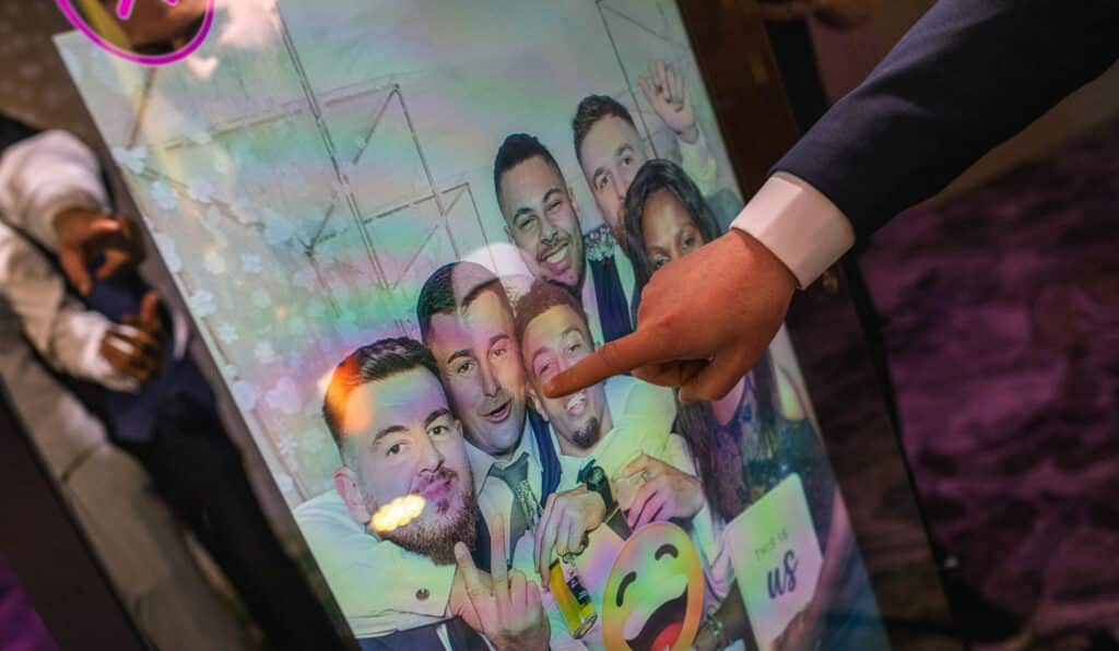 A photo preview on the Mirror X of guests at a party, prom or weddingusing props