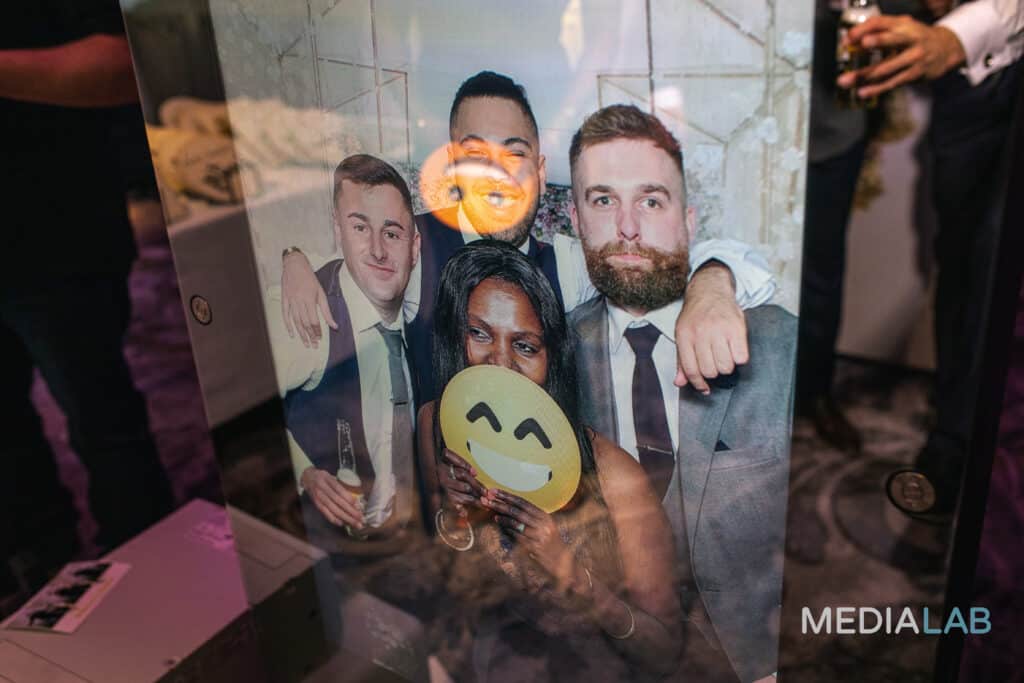 A photo preview on the Mirror X of guests at a party, prom or wedding using props