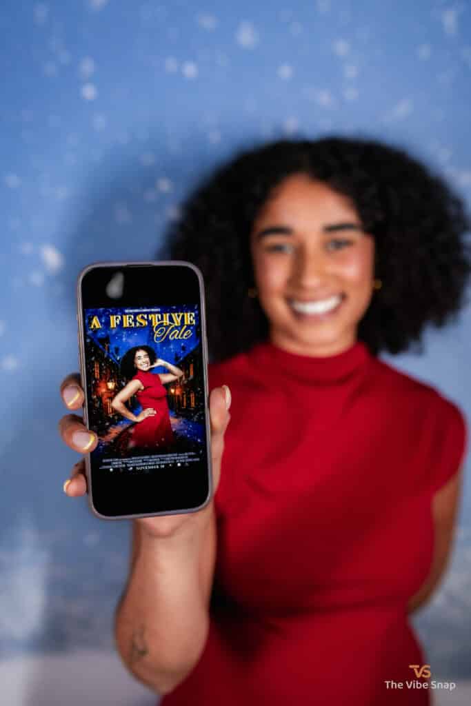 A young woman holding a phone with A Festive Tale movie poster
