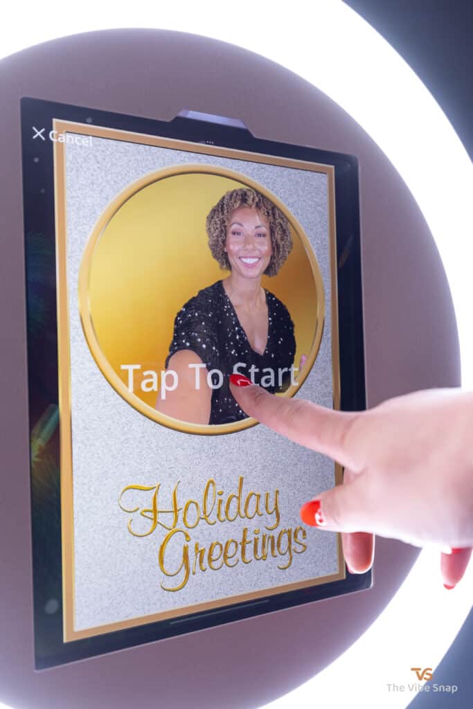 Mixed race lady starting the photo booth holiday greeting experience