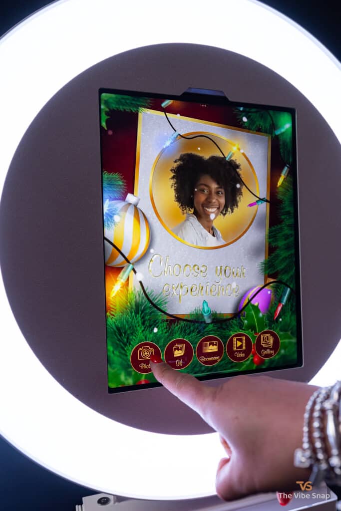 Person choosing photo experience on iPad based booth