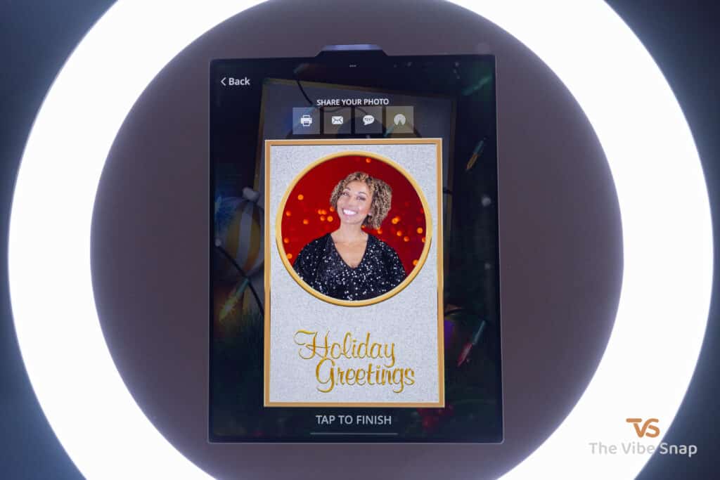 Final photo of mixed race woman showing on iPad booth