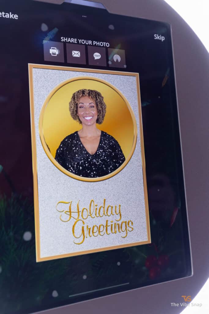 Final photo of mixed race woman showing on ipad booth with sharing options