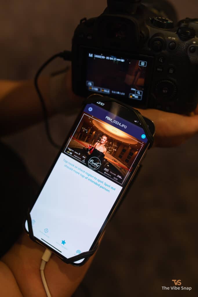 Headshot photo of smiling lady on the phone linked to the mirrorless camera